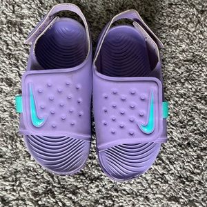 Toddler girls purple and teal Nike stingray sandals with adjustable strap.